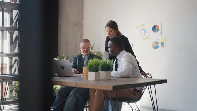 Teamwork in office, marketing professionals or program developers communicating. Financial analysis department of big international company, multiethnic coworkers discussing new business project