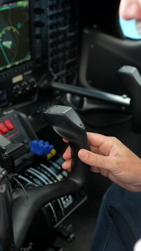 Pilot hands flying a small aircraft in the cockpit