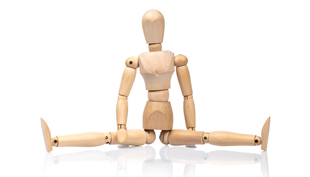 Wooden mannequin sitting in a wide straddle split with arms resting on knees, isolated on white, representing flexibility and movement