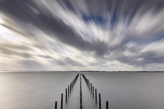 Storm at Lake D&uuml;mmer, jetty, weather, clouds, expanse, long exposure, Lembruch, Lower Saxony, Germany