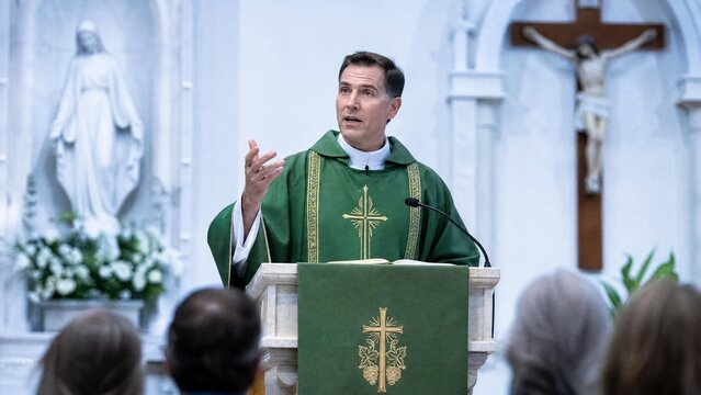 Catholic Priest Giving Sermon at Pulpit during Holy Mass in Church
