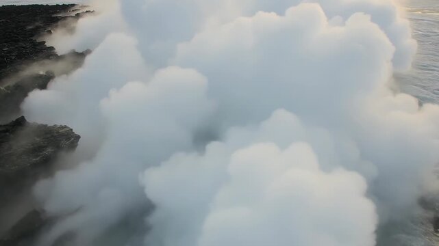 Rising white steam plume, volcanic coast emitting vapor as sea contacting hot rock, foamy surf