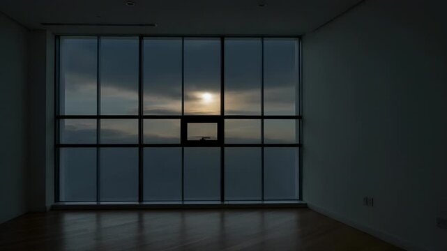 Shifting sunlight and passing clouds changing brightness in empty living room, mullioned window