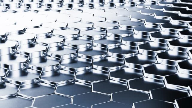 Metallic chrome hexagon grid surface rising and falling in a wave pattern as a seamless loop 3D animation, perfect for technology automotive industrial or premium brand background videos