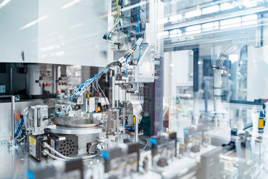 Intricate machinery inside modern factory, Stuttgart, Germany