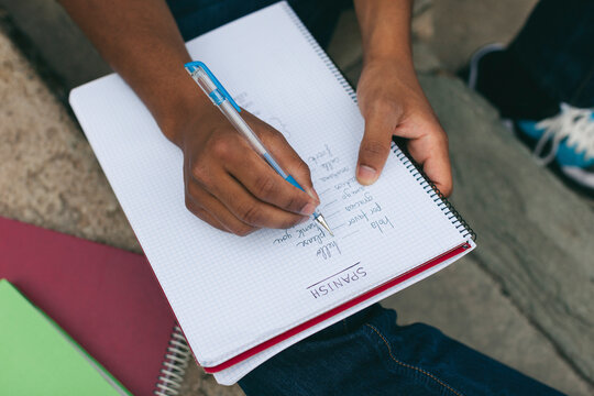 Young Afro-american man studying language