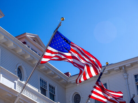 American flag flying against a cloudless blue sky