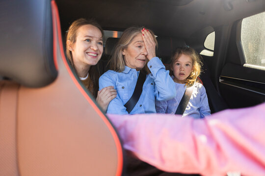 Multi generational family on car road trip