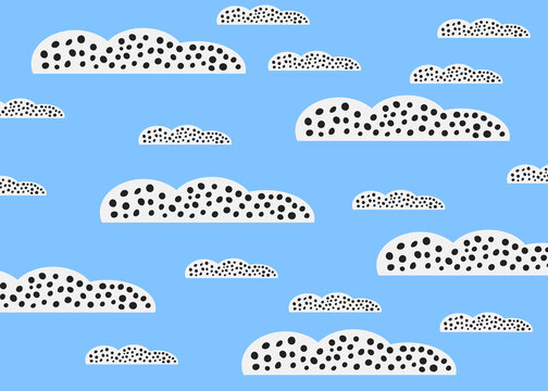 Playful cartoon illustration of dotted clouds in a blue sky