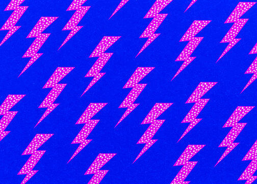 Vibrant pink lightning bolt pattern on blue background
