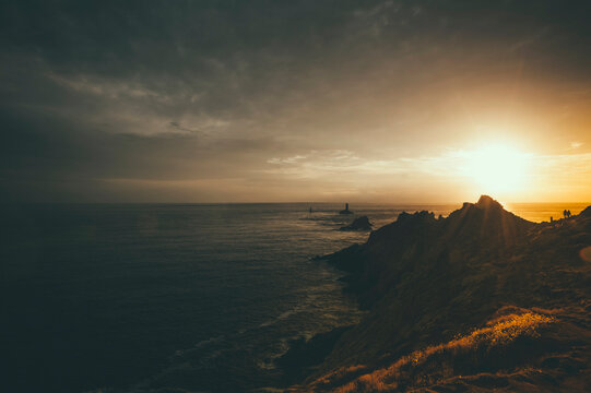 France, Brittany, Pointe du Raz, sunset at the coast with lighthouses Phare de la Vieille and Phare de Tevennec
