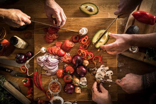 Hands chopping vegetables