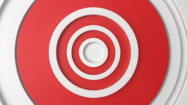 A vibrant red circle centered within concentric white rings