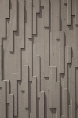 Fototapeta premium Vertical Abstract Concrete Wall Texture with Modern Geometric Architectural Pattern