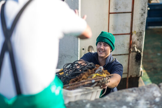 Fishermen working on trawler