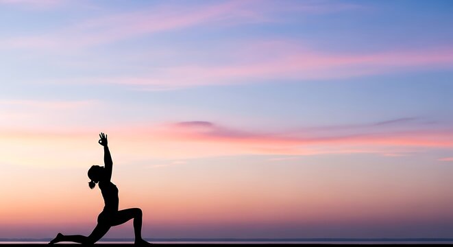Woman practicing yoga lunge pose against a serene sunset sky at dusk