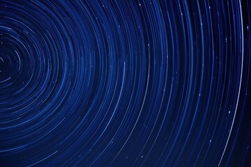 Obraz premium The Star Trails Above a Dark Night Sky Creating Circular Motion Light Patterns