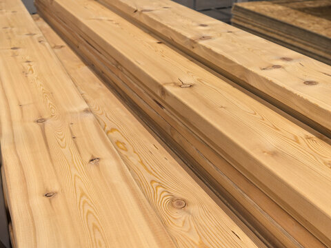 Long Wooden Boards Stacked in Hardware Store