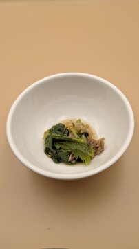 Scooping Kaeng Om Kruang Nai Kai Thai Spicy Chicken Giblet Soup 4K Vertical