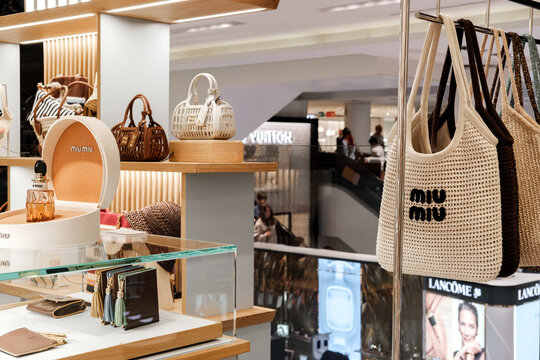 Luxury Designer Handbags and Miu Miu Tote Display in Upscale Department Store Boutique Milan Italy May 14, 2026