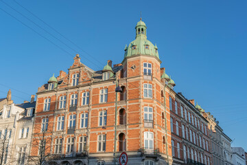 Fototapeta premium Copenhagen Historic Red Brick Building Facade with Green Copper Dome, Architecture