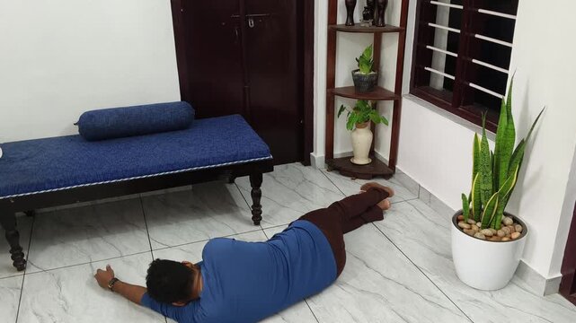 Unconscious young adult person faint and falling down on living room floor. Dizziness, stroke, hypertension, passed out, vertigo slip, high blood pressure or  heart attack sudden death concept.