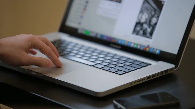 man finger swiping laptop browse internet at workplace close up. businessman working digital device. freelancer scroll touchpad computer enjoy online job. Website. Web. business woman. company office