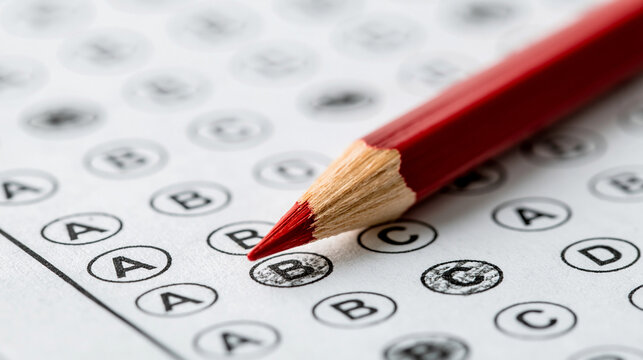 Test Time: A red pencil poised over a multiple-choice test, with answers already marked, signifies the pressure and focus of an examination.