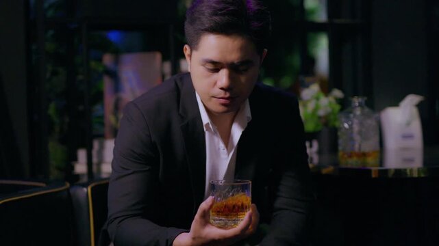 businessman holding whiskey, a restaurant