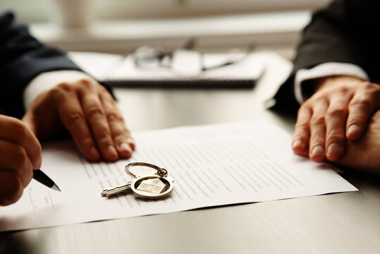 Real estate agent signing a contract buy-sell home