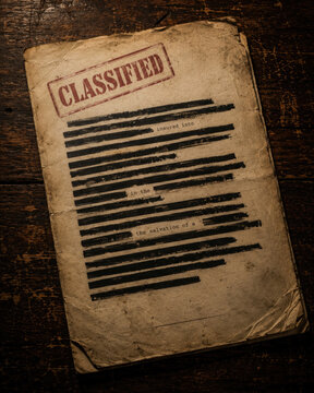 Old Classified Document with Red Stamp and Blacked Out Text on Wooden Surface paper vintage