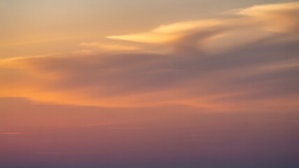Fototapeta premium Colorful sunset sky with soft clouds and pastel twilight background