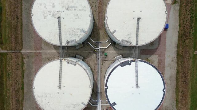 High angle view of major energy sector containment systems managing high capacity gas reserves