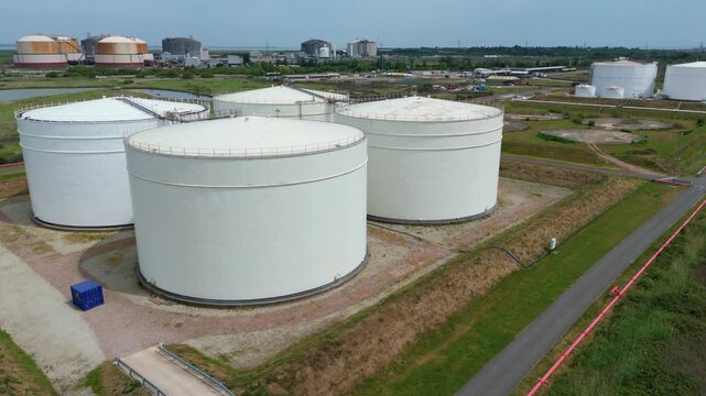 Close Up Aerial View of Energy Infrastructure Showing Heavy Duty Fuel Storage Tanks and Interconnecting Pipes UK