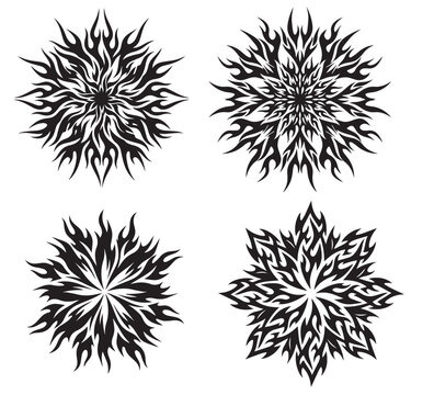 Set of four black and white tribal ornament designs with flame-like patterns and symmetrical floral shapes for tattoo art and graphic design projects
