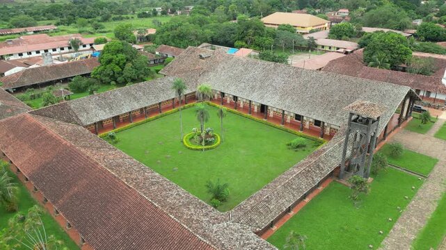 Flyover green cloister courtyard of low cathedral in Concepcion, BOL
