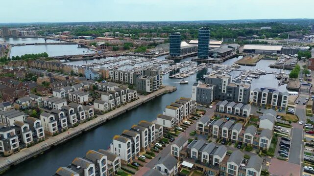 Drone shot of yachts docked at Chatham Maritime Marina by the twin blue Azure towers on St Marys Island Rochester England
