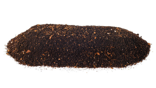 Pile of dark soil with organic matter and small stones