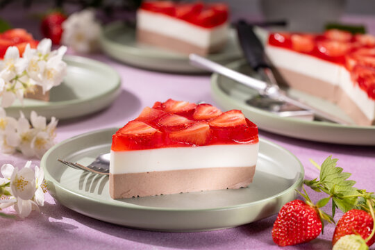 Strawberry mousse cake slice with jelly topping