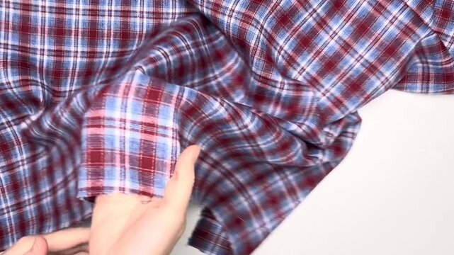 This plaid cotton fabric features a medium density blend that provides excellent shape retention and breathable comfort making it a perfect choice for tailored shirts dresses and casual home wear