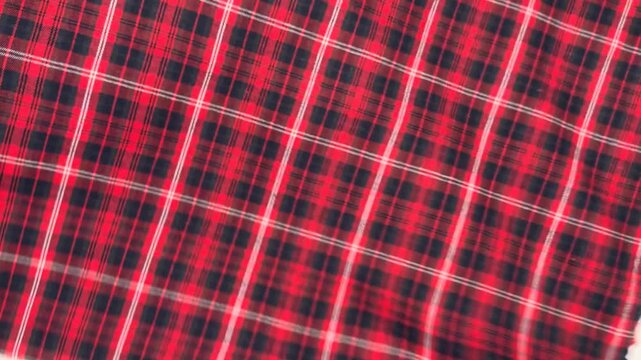 This red plaid cotton fabric features a medium density blend that provides excellent shape retention and breathable comfort making it a perfect choice for shirts dresses and casual home apparel