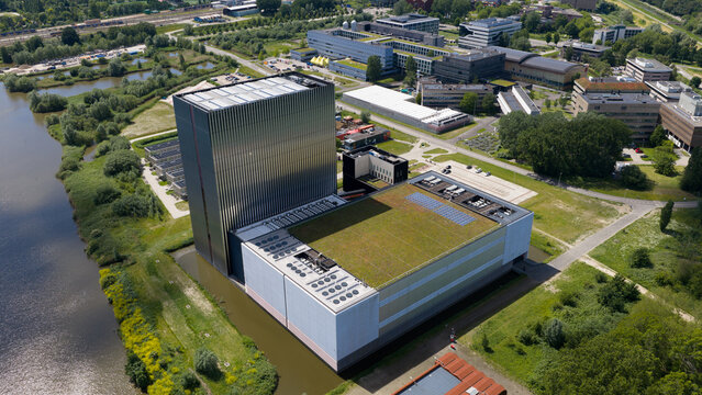 Aerial view of the Equinix Data Centers Science Park 610 featuring a tall metallic tower and green roof surrounded by modern architecture in Amsterdam, Noord-Holland, Netherlands.