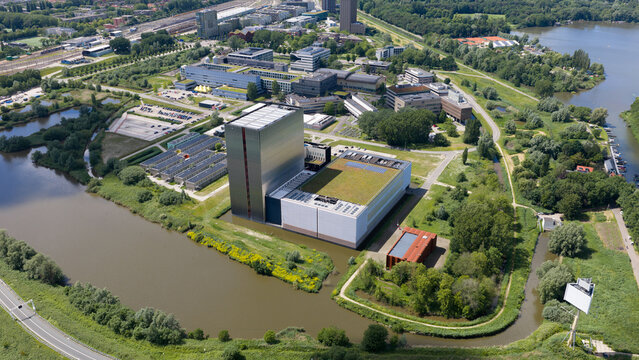 Aerial view of the Equinix Data Centers at Science Park featuring modern architecture, metallic facades, and green roofs surrounded by canals in Amsterdam, Noord-Holland, Netherlands.