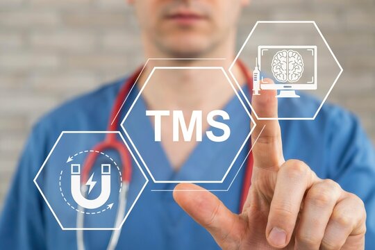 Doctor pressing a virtual button with tms acronym for transcranial magnetic stimulation treatment