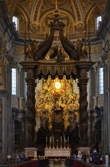 Rome, Italy 09.04.2020: Architectural details of the Dome (Cupola) and the Bernini's Baldacchino (baldachin or canopy) in St. Peter's Basilica (Papal Basilica of Saint Peter) © Denise Serra