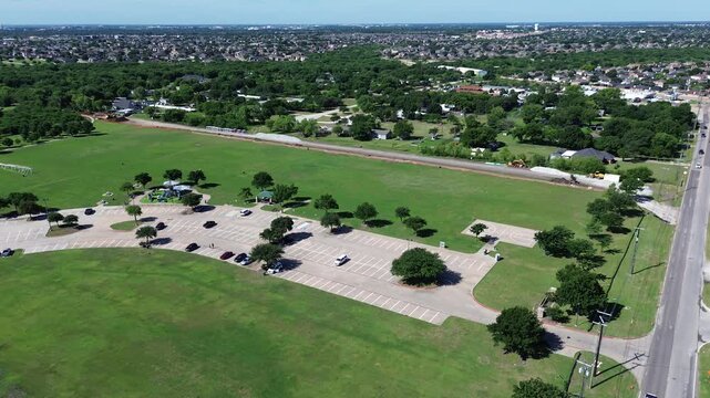 Playground, basketball court, adjacent residential streets, colorful equipment forming clear recreational hub surrounds Webb Community Park anchors Mansfield Webb Rd corridor, South Arlington, TX