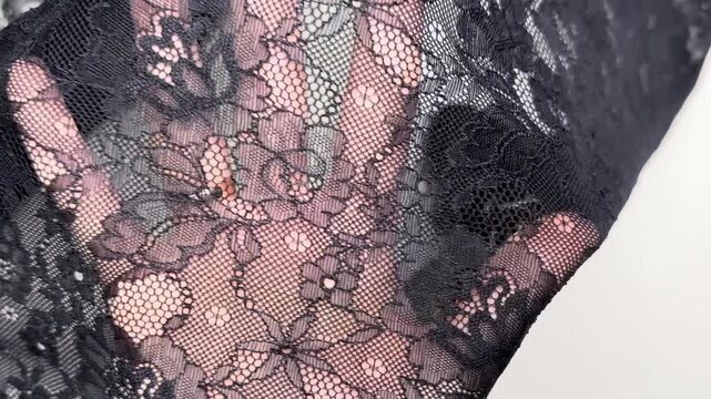 Dark grey melange knit textile featuring a soft stretchy texture and rhombus pattern ideal for sewing comfortable cardigans trousers and stylish apparel dresses.