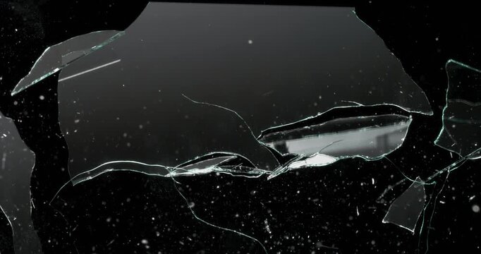This video showcases a realistic glass shatter effect animation set against a dark background, making it perfect for a variety of motion graphics and visual effects projects you might have in mind