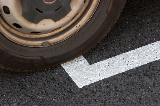 Close up of car tire on asphalt