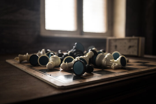 Chess board game concept of business ideas and competition and strategy ideas concep. Chess figures on a dark background with smoke and fog. Selective focus